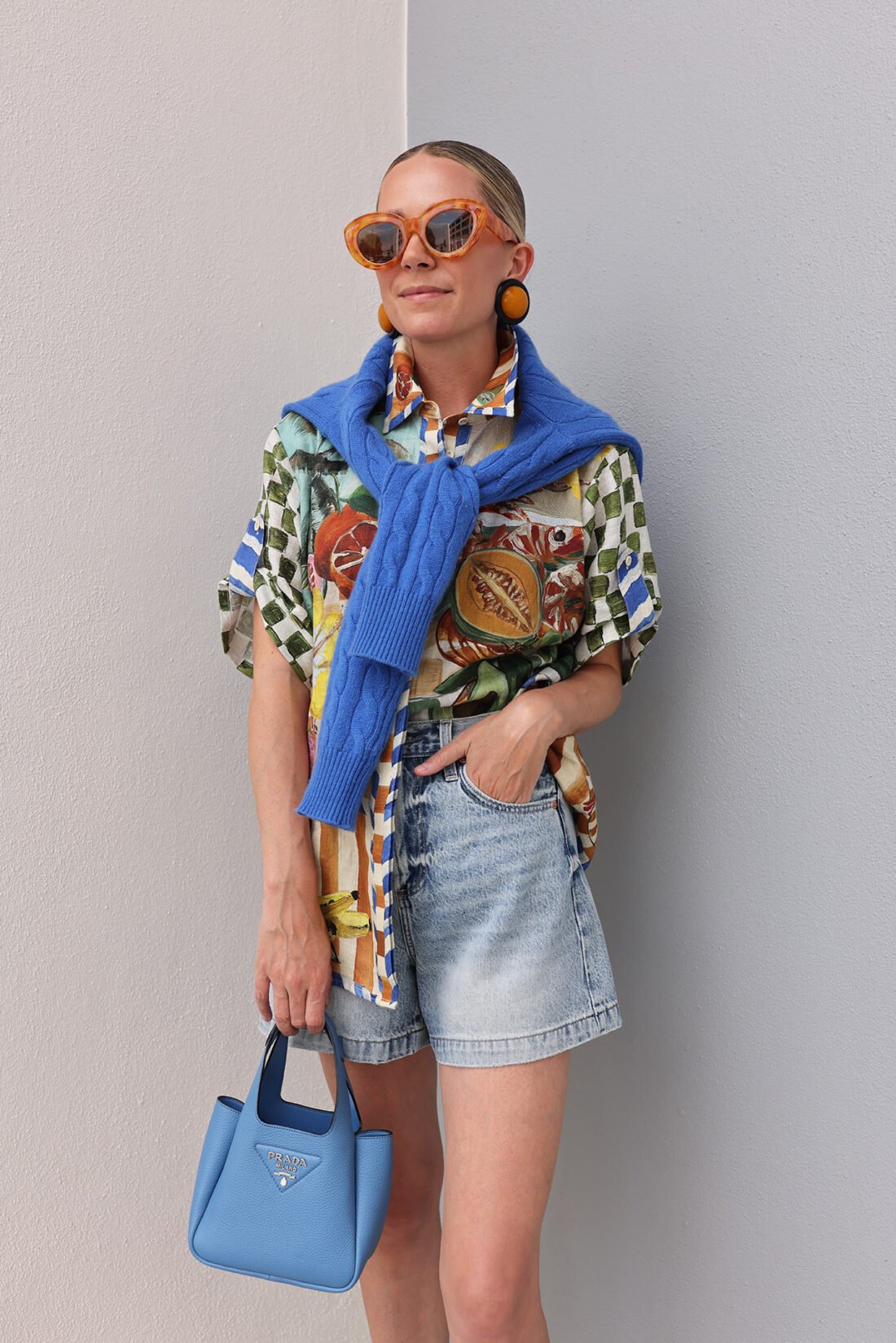 blue outfit, cable sweater, printed blouse ootd, prada leather bag
